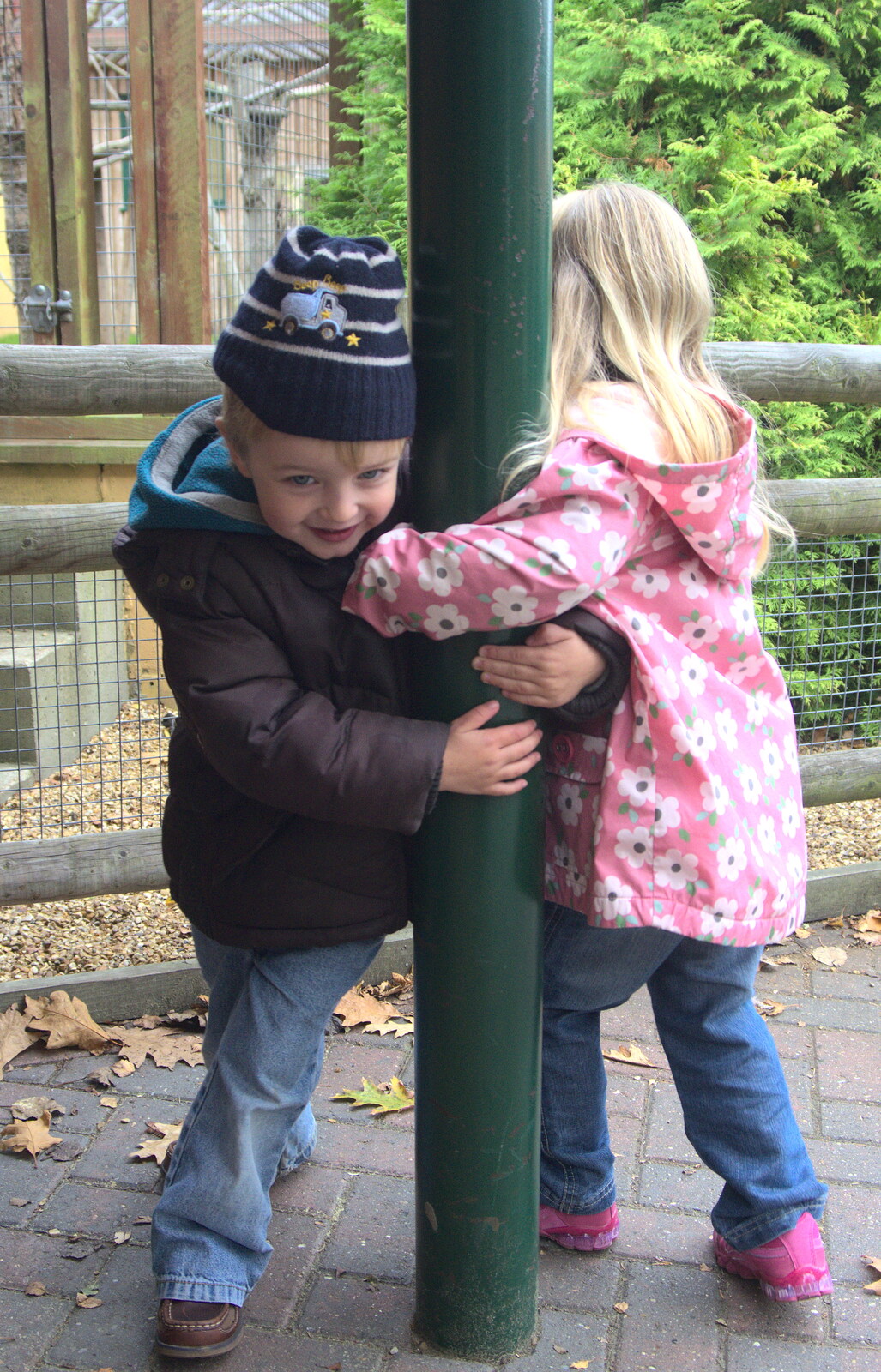 Fred and Anna spin round a pole from An Appley Sort of Zoo Day, Carleton Rode and Banham, Norfolk - 14th October 2012