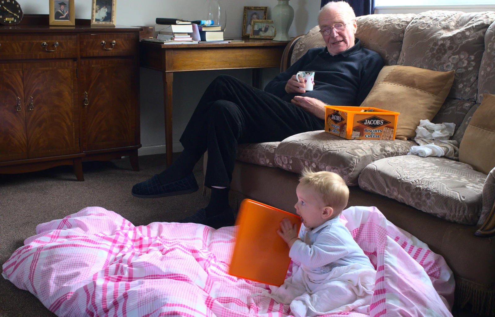 Grandad watches harry eat a plastic lid, from Butterflies and Fireworks, Brome and Wortham, Suffolk and Norfolk - 3rd November 2012