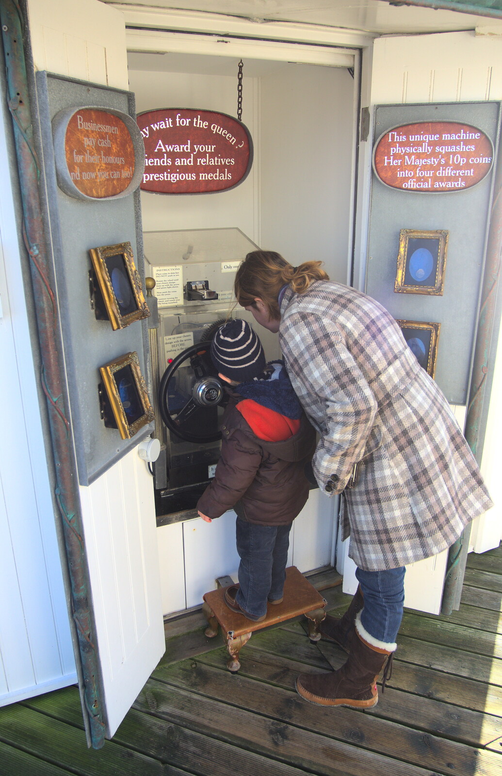 Fred and Isobel mash a coin up from A Busy Day, Southwold and Thornham, Suffolk - 11th November 2012