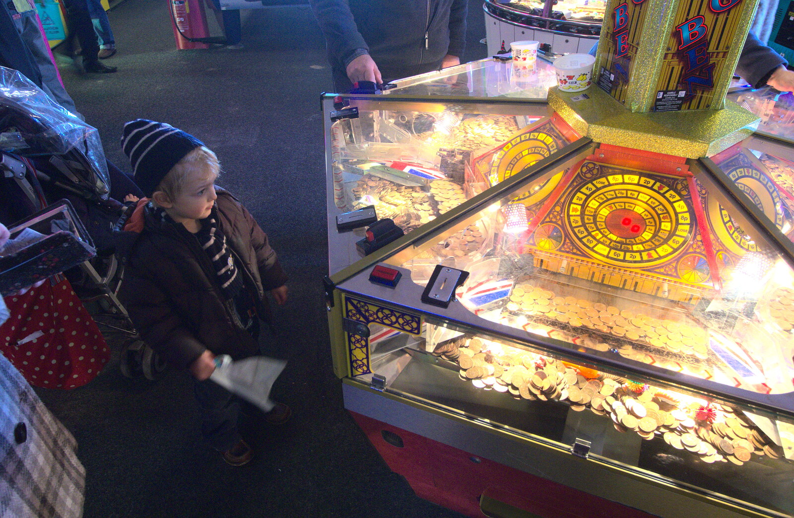 Fred considers the coin-push machine from A Busy Day, Southwold and Thornham, Suffolk - 11th November 2012