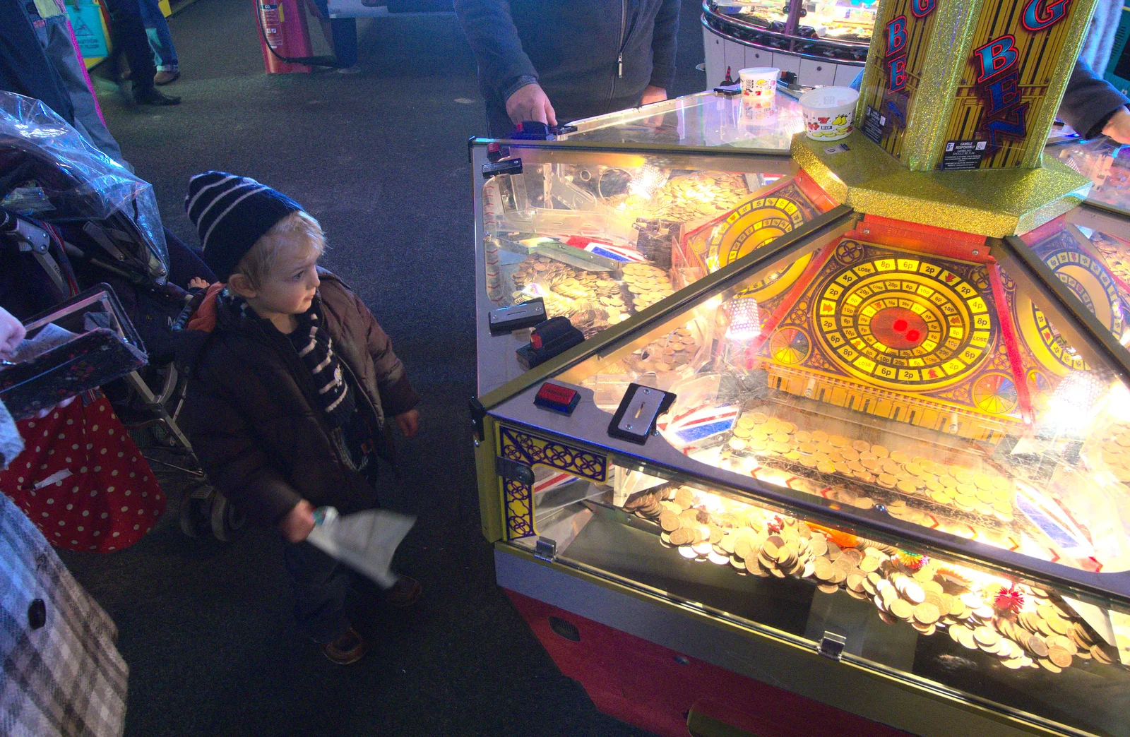 Fred considers the coin-push machine, from A Busy Day, Southwold and Thornham, Suffolk - 11th November 2012