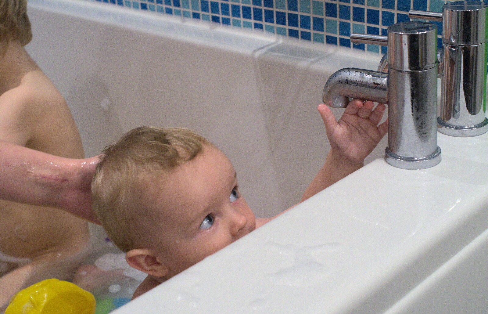 Harry pokes around with the taps at bath-time from Sis Comes to Visit, Eye, Suffolk - 18th November 2012