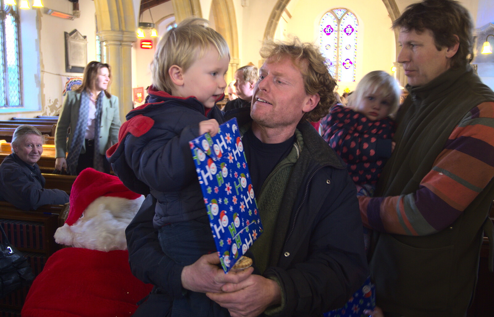 Oak gets a Santa present from Fred's Nursery Nativity, Palgrave, Suffolk - 13th December 2012