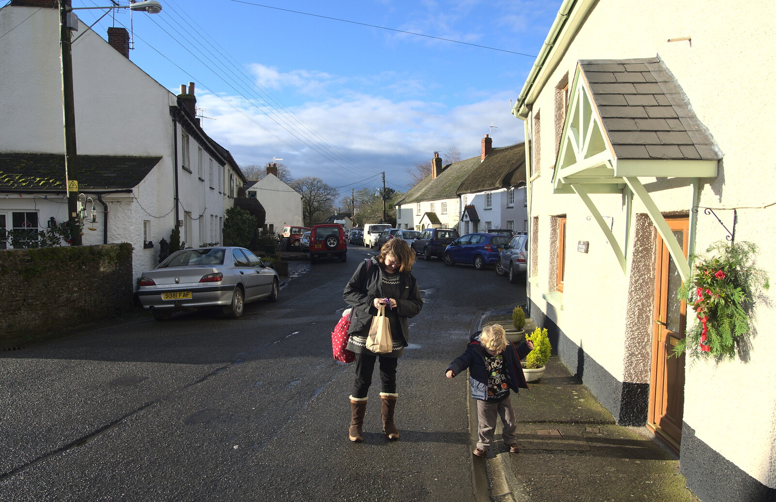 Isobel and Fred walk back through Spreyton from A Trip to Spreyton, Devon - 24th December 2012
