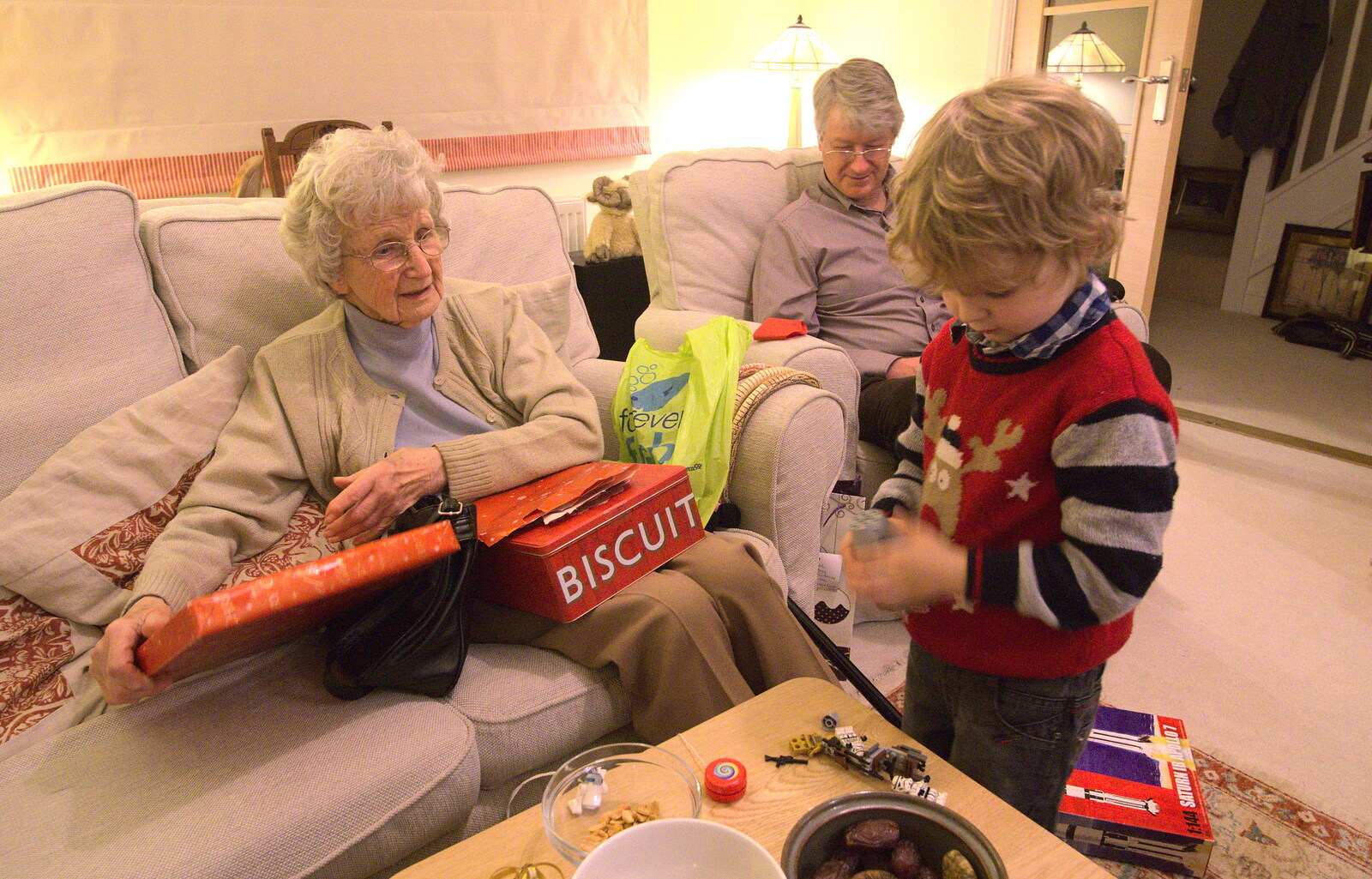 Grandmother gets some biscuits from Christmas Day in Spreyton, Devon - 25th December 2012