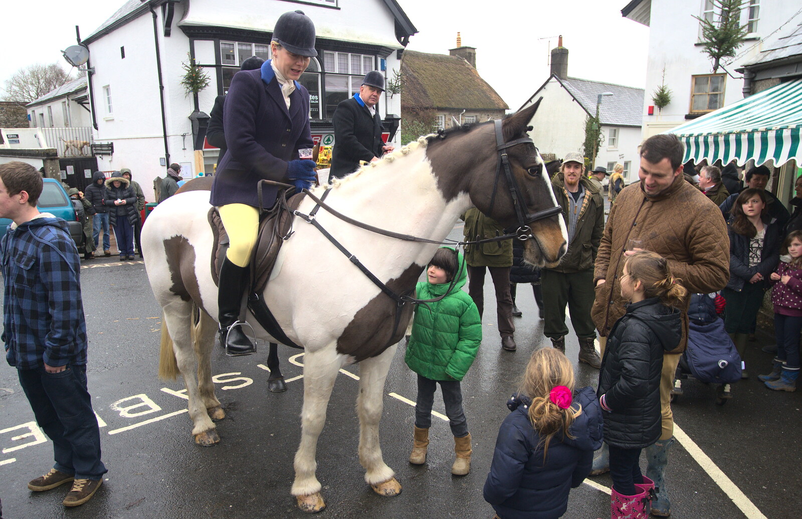 Children crowd around the horses from The Boxing Day Hunt, Chagford, Devon - 26th December 2012