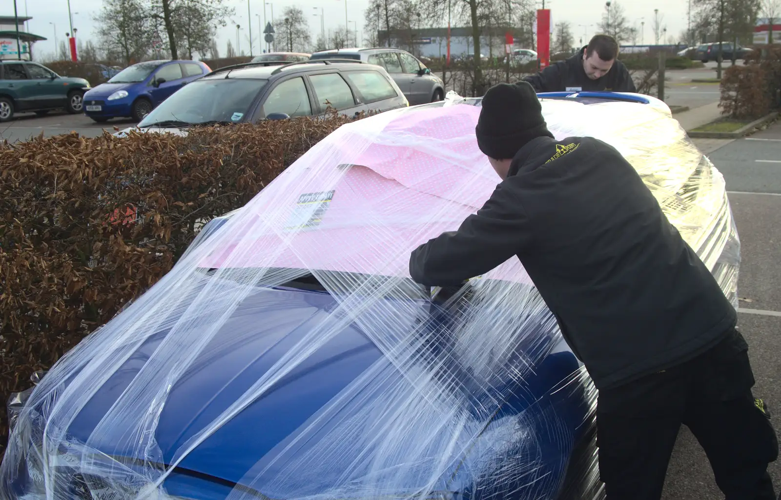 The staff continue with their cling-film, from New Year's Day and Lunch at the White Horse, Ipswich, Finningham and Brome - 1st January 2013