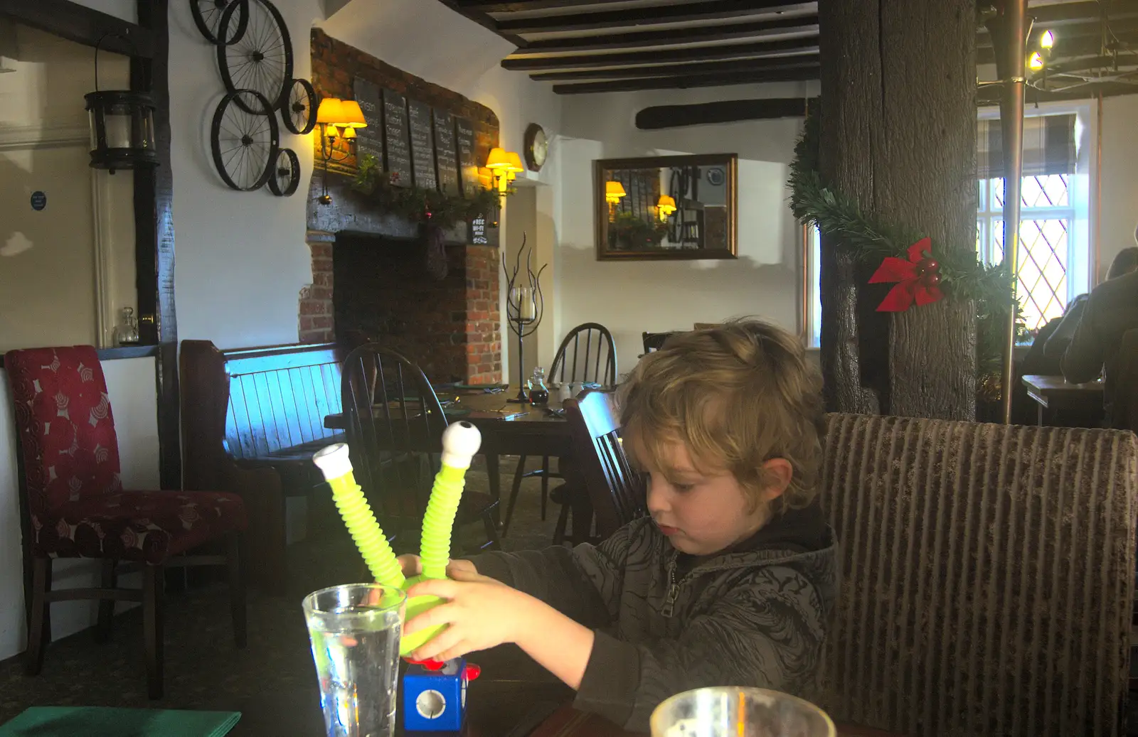 Fred plays with some sort of space toy, from New Year's Day and Lunch at the White Horse, Ipswich, Finningham and Brome - 1st January 2013