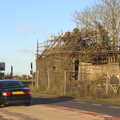 A car drives past the wrecked building, New Year's Day and Lunch at the White Horse, Ipswich, Finningham and Brome - 1st January 2013