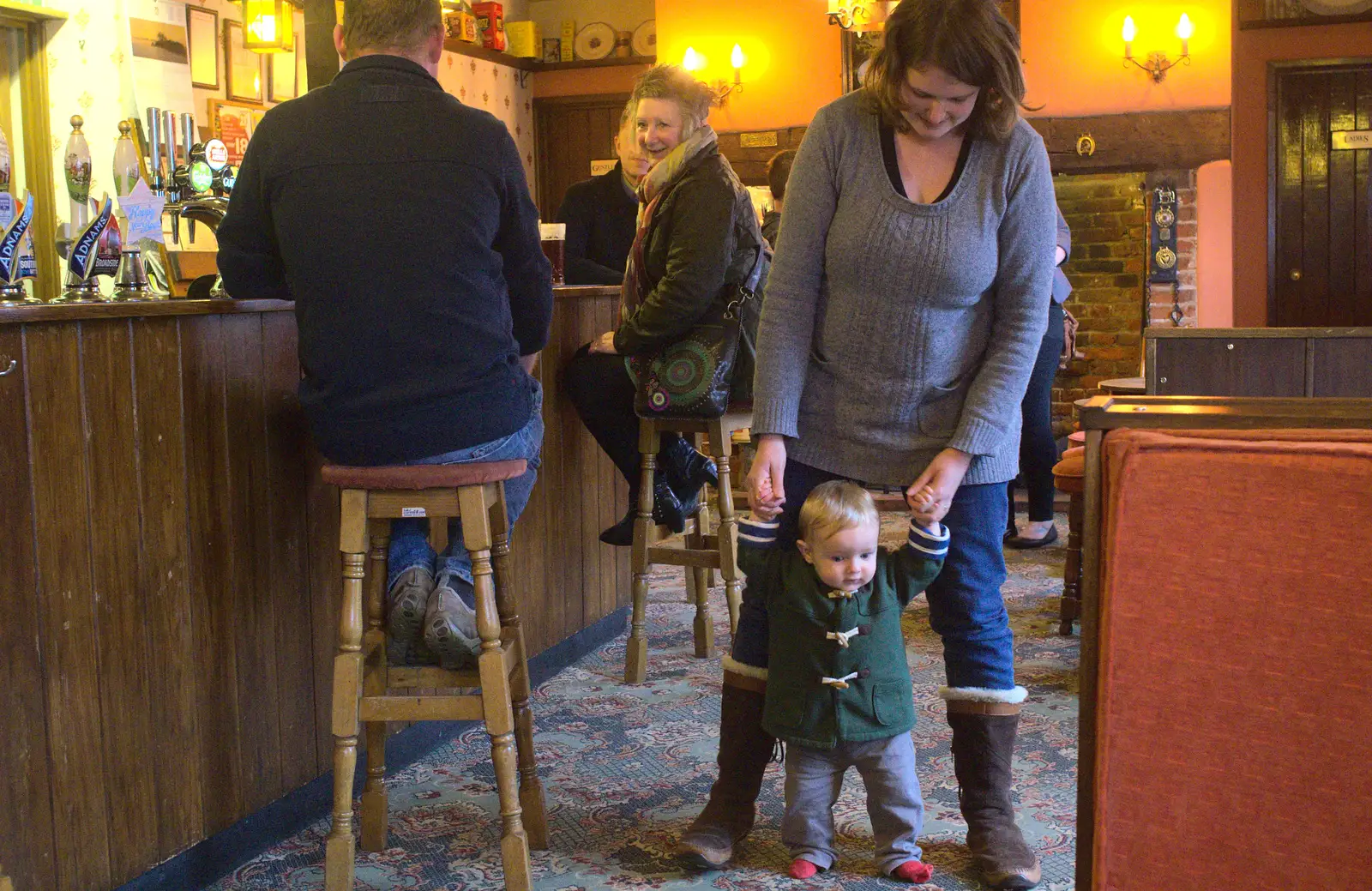 Gaz and Sandy watch Harry trundle through the pub, from New Year's Day and Lunch at the White Horse, Ipswich, Finningham and Brome - 1st January 2013