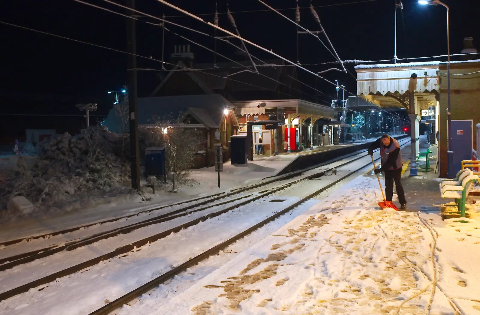 Adrian clears snow down at Diss Station, from A Couple of Snow Days, Brome, Suffolk - 16th January 2013