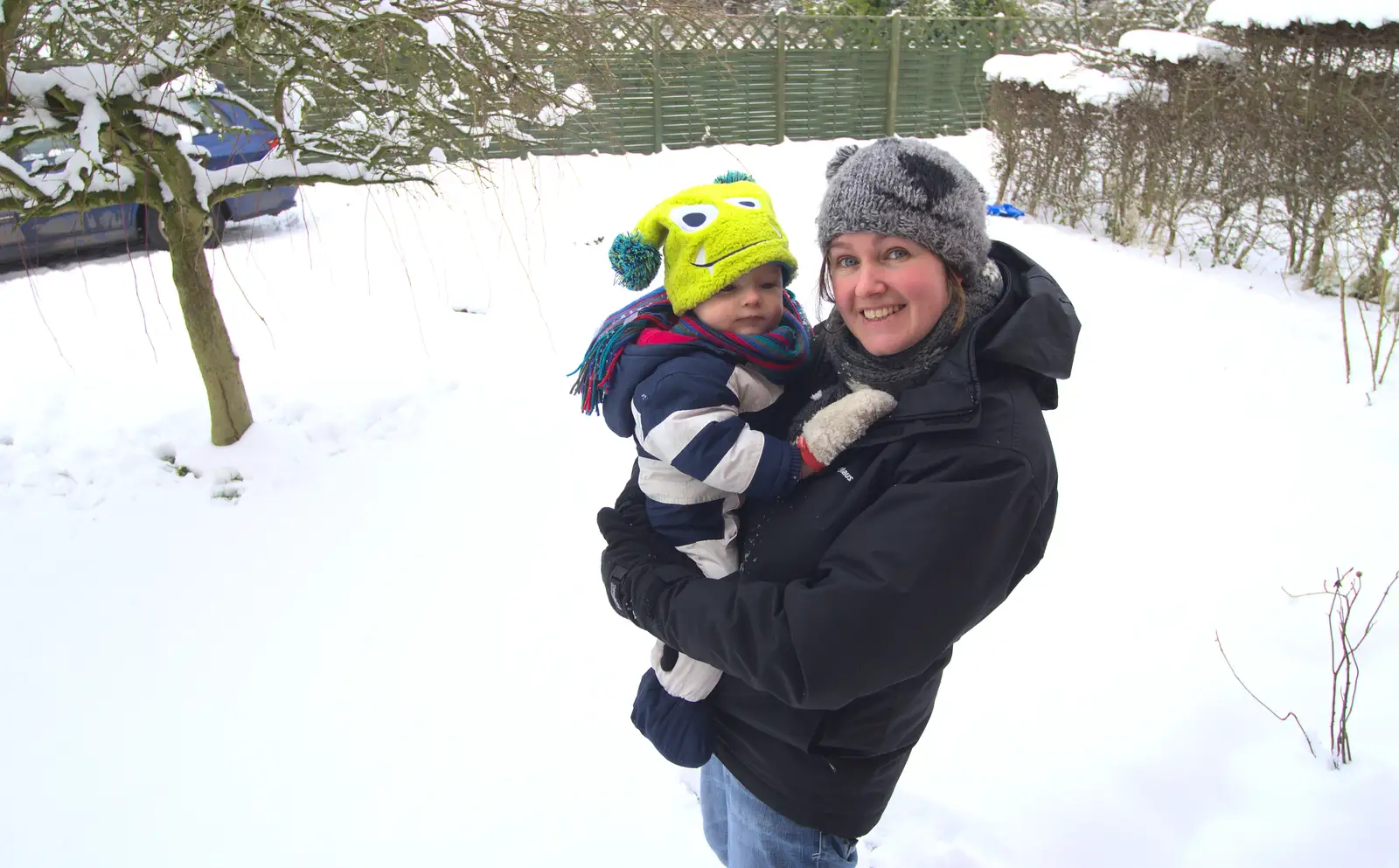 Isobel scoops Gabes up, from More Snow Days and a Wind Turbine is Built, Brome, Suffolk - 19th January 2013