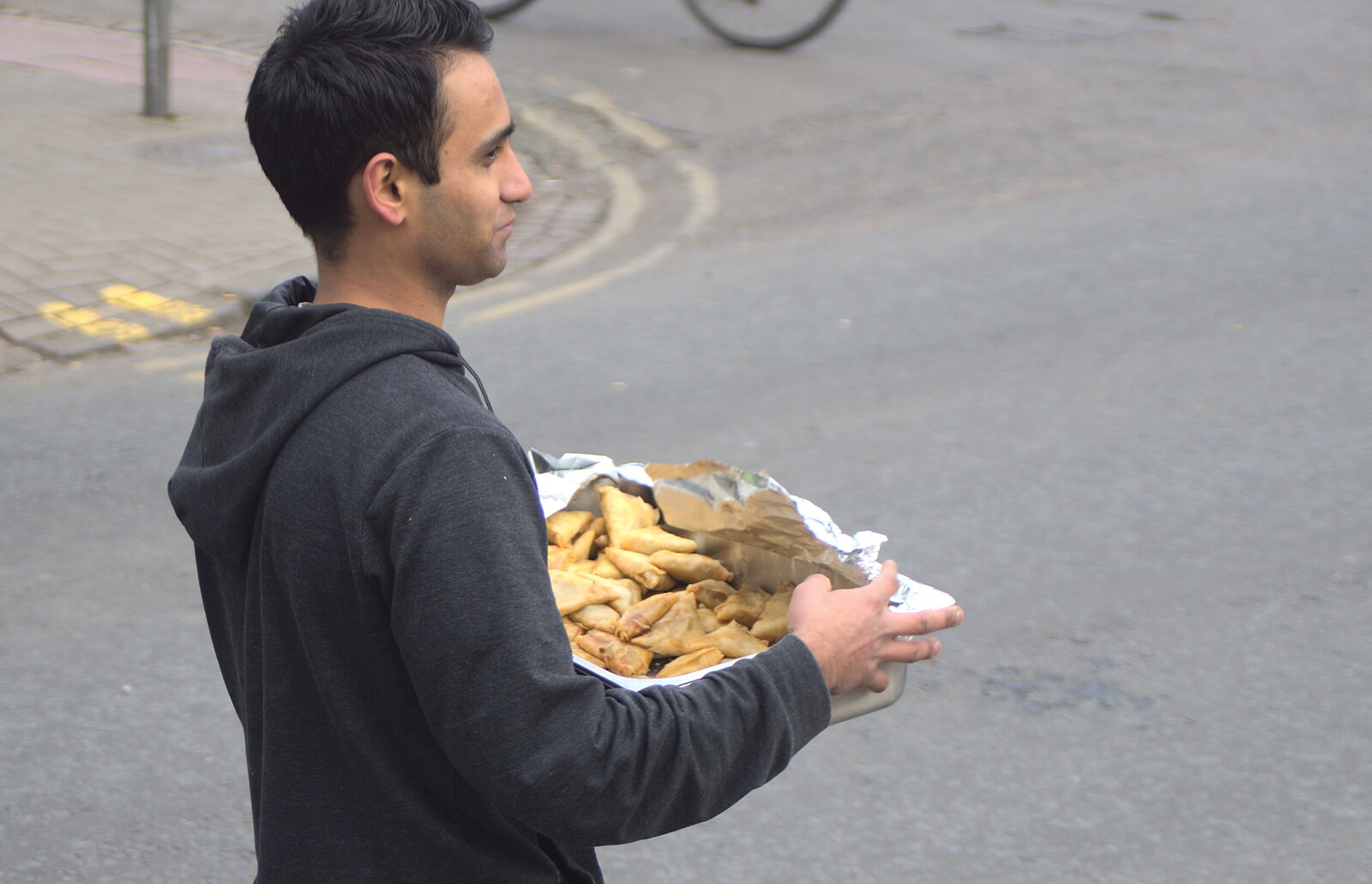 A dude passes samosas around from An Anti-Fascist March, Mill Road, Cambridge - 23rd February 2013