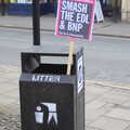 A placard is left in a bin, An Anti-Fascist March, Mill Road, Cambridge - 23rd February 2013