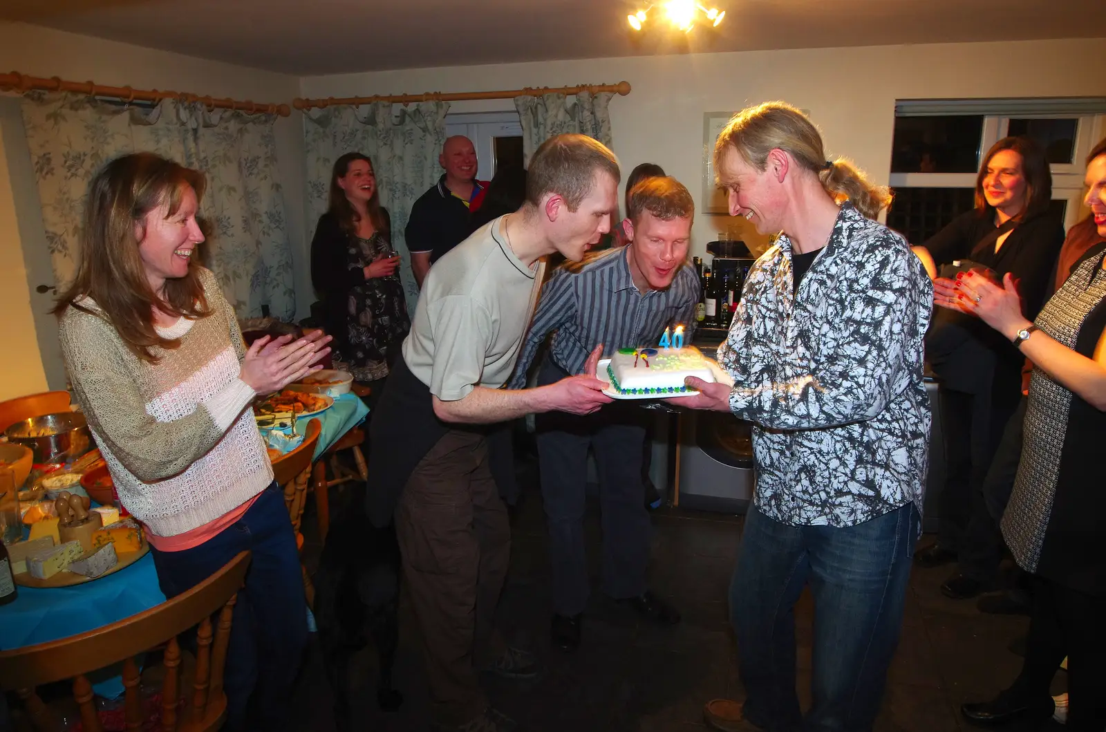 Andy and Mike blow the candles out, from Mikey P and Andy's 40th Birthday, Thorpe Abbots, Norfolk - 16th March 2013