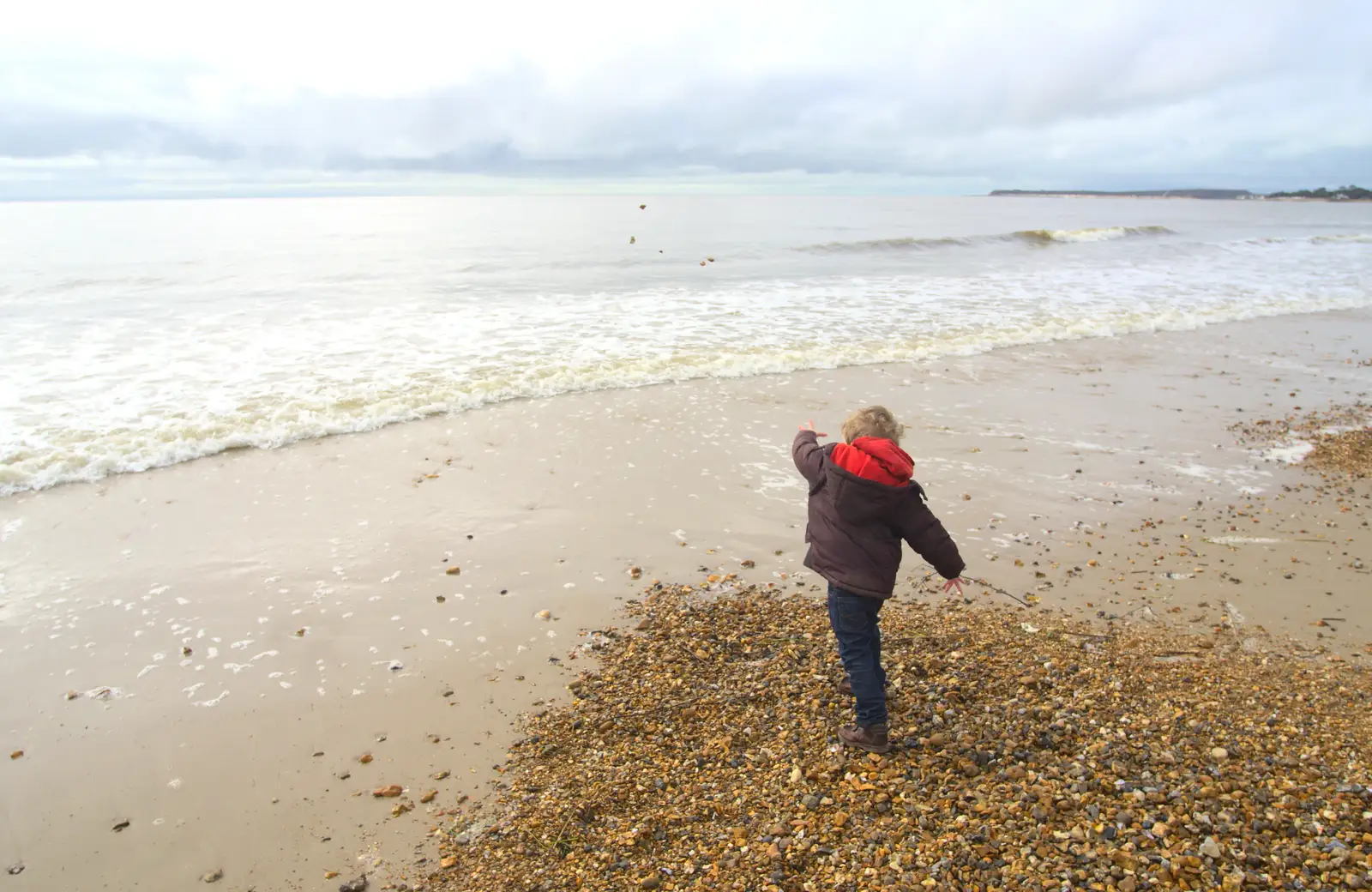 Fred hurls stones into the sea, from A Trip to Highcliffe Castle, Highcliffe, Dorset - 18th March 2013