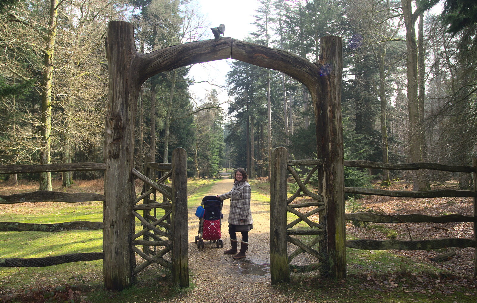 Isobel pauses by a wooden gate from The Ornamental Drive, Rhinefield, New Forest - 20th March 2013