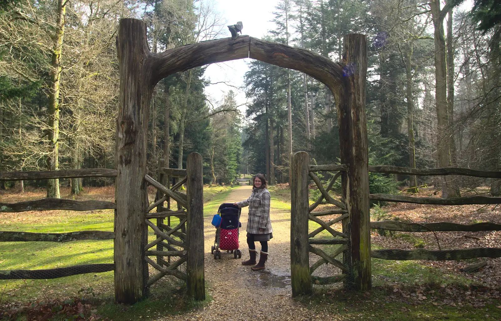 Isobel pauses by a wooden gate, from The Ornamental Drive, Rhinefield, New Forest - 20th March 2013