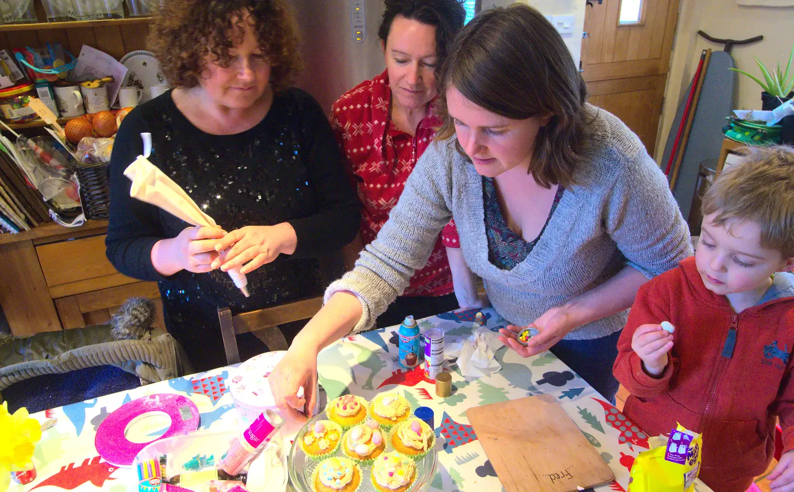 Louise is poised with an icing bag, from An Easter Visit from Da Gorls, Brome, Suffolk - 2nd April 2013