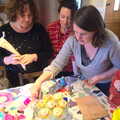 Louise is poised with an icing bag, An Easter Visit from Da Gorls, Brome, Suffolk - 2nd April 2013