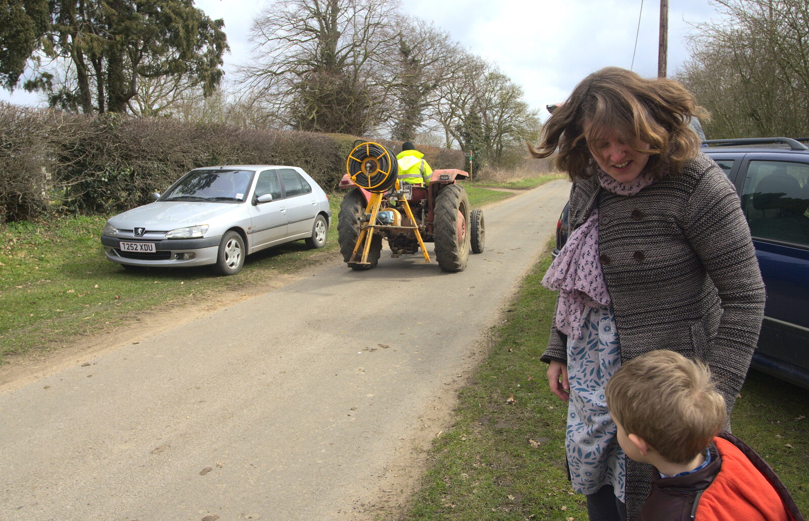 A tractor trundles down the road from An Easter Visit from Da Gorls, Brome, Suffolk - 2nd April 2013