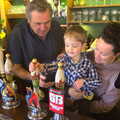 Fred has a go at pulling a pint, An Easter Visit from Da Gorls, Brome, Suffolk - 2nd April 2013