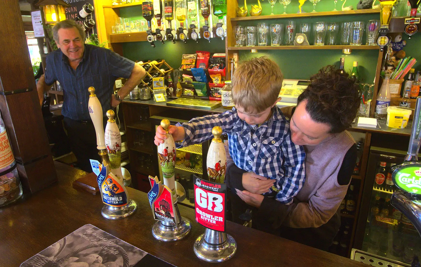 Alan watches as Fred pulls a pint, from An Easter Visit from Da Gorls, Brome, Suffolk - 2nd April 2013