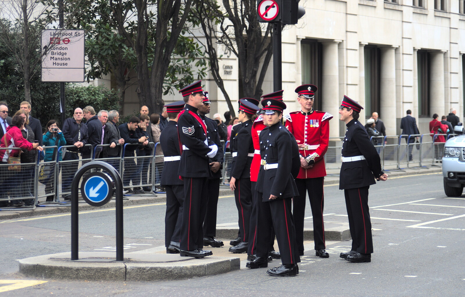 Military types hang around on a traffic island from Margaret Thatcher's Funeral, St. Paul's, London - 17th April 2013