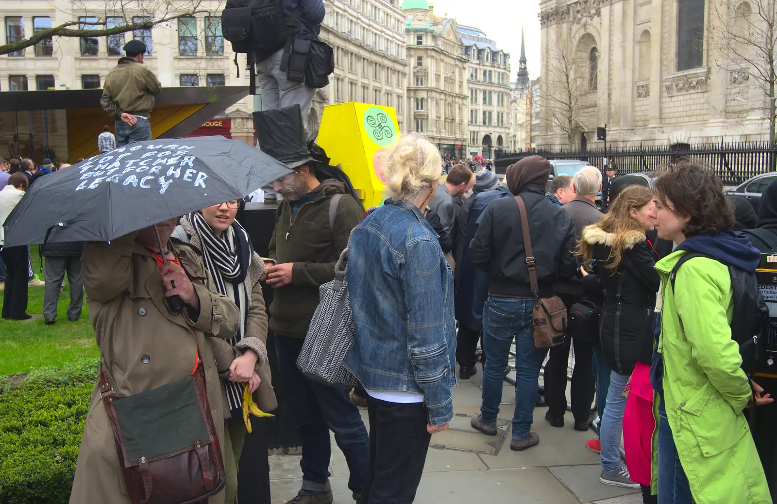 A small protest is occuring, from Margaret Thatcher's Funeral, St. Paul's, London - 17th April 2013