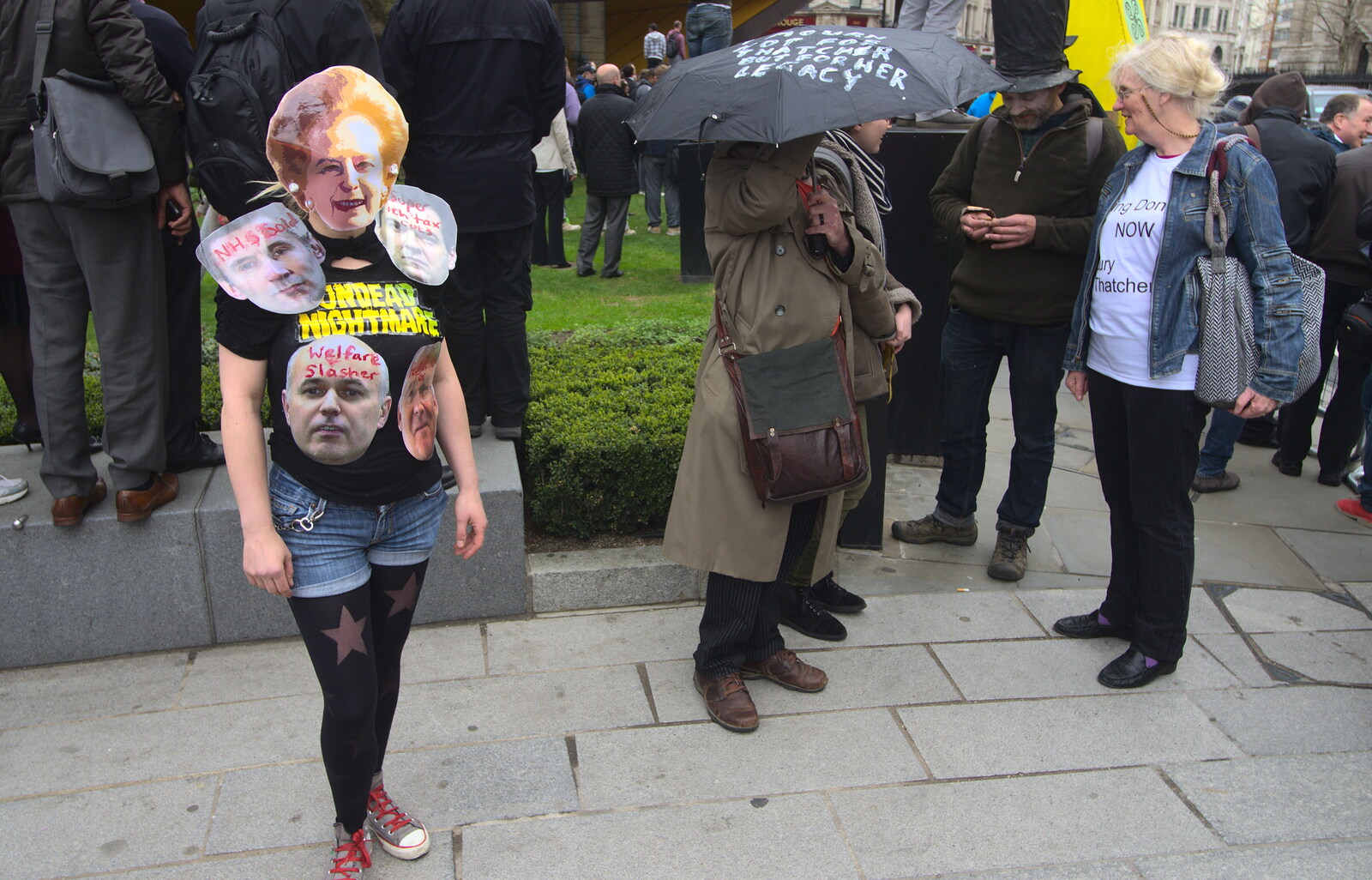 Someone with a creepy Thatcher mask on from Margaret Thatcher's Funeral, St. Paul's, London - 17th April 2013