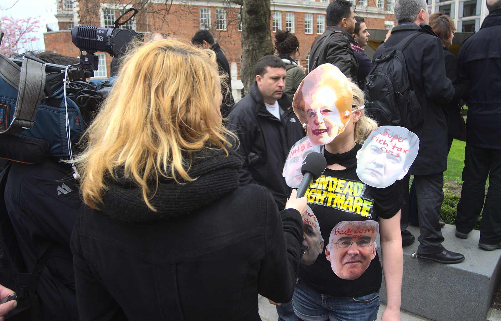 A protester is interviewed from Margaret Thatcher's Funeral, St. Paul's, London - 17th April 2013