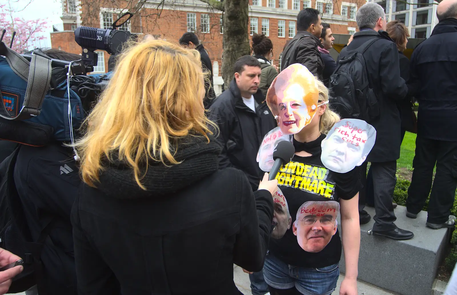 A protester is interviewed, from Margaret Thatcher's Funeral, St. Paul's, London - 17th April 2013