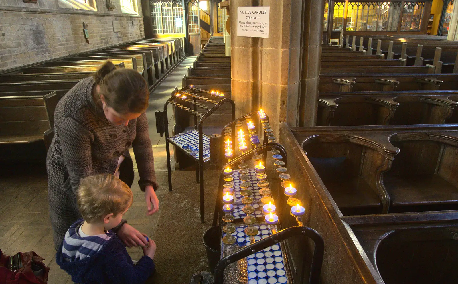 Fred and Isobel light a votive candle, from Chesterfield and the Twisty Spire, Derbyshire - 19th April 2013