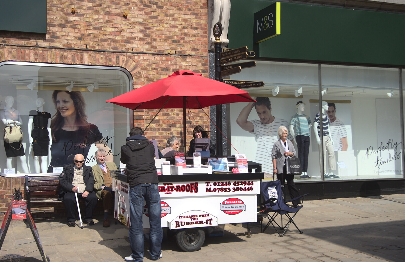 A portable stall tries to sell rubber roofing from Chesterfield and the Twisty Spire, Derbyshire - 19th April 2013