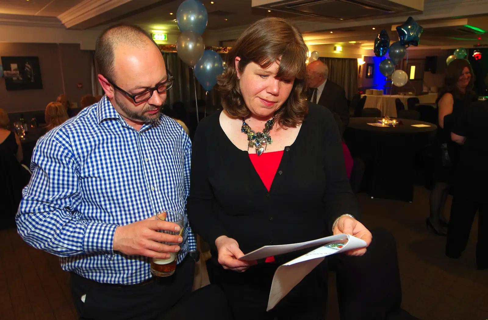 Matt and Sis read up on James's life story, from Uncle James's Ninetieth Birthday, Cheadle Hulme, Manchester - 20th April 2013