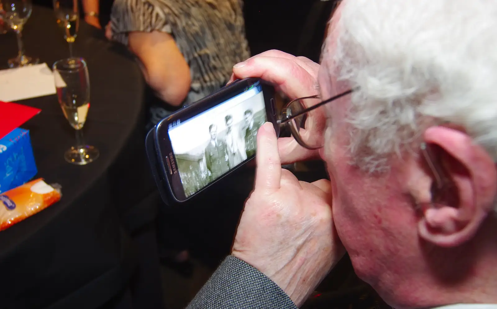 James looks at an old 1940s photo, from Uncle James's Ninetieth Birthday, Cheadle Hulme, Manchester - 20th April 2013