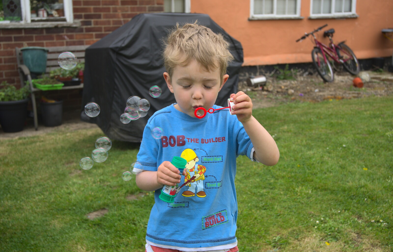 Fred blows bubbles from Rosie and Henry's Birthday Party, Mellis, Suffolk - 5th May 2013
