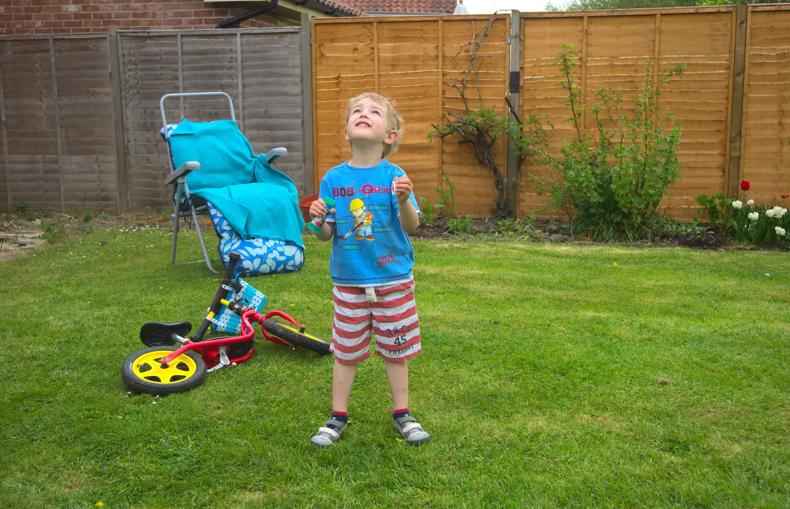 Back in the garden, Fred watches bubbles, from Rosie and Henry's Birthday Party, Mellis, Suffolk - 5th May 2013