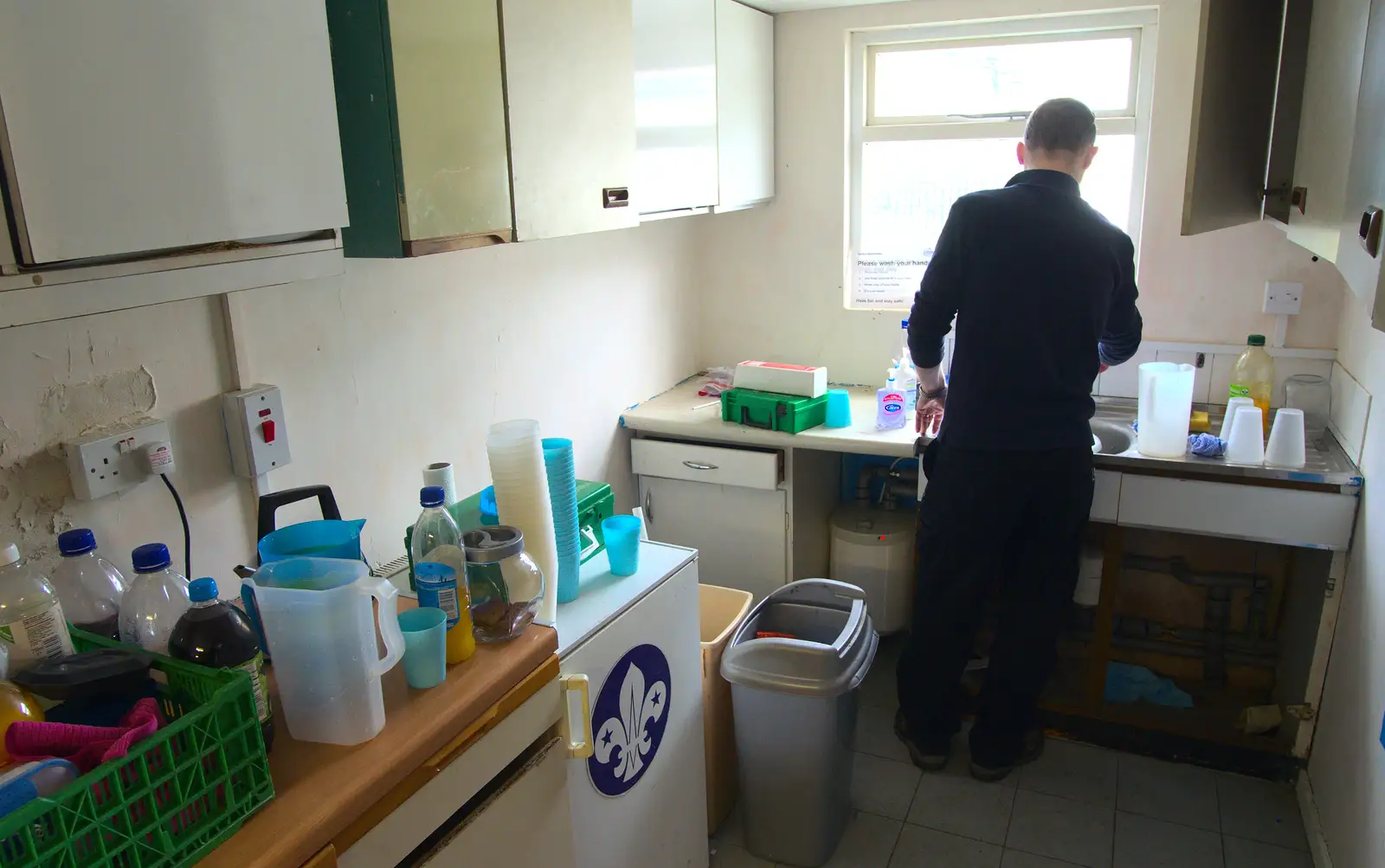 Andy P gets some water in the un-fitted kitchen, from Demolishing The 1st Eye Scout Hut, Wellington Road, Eye, Suffolk - 11th May 2013