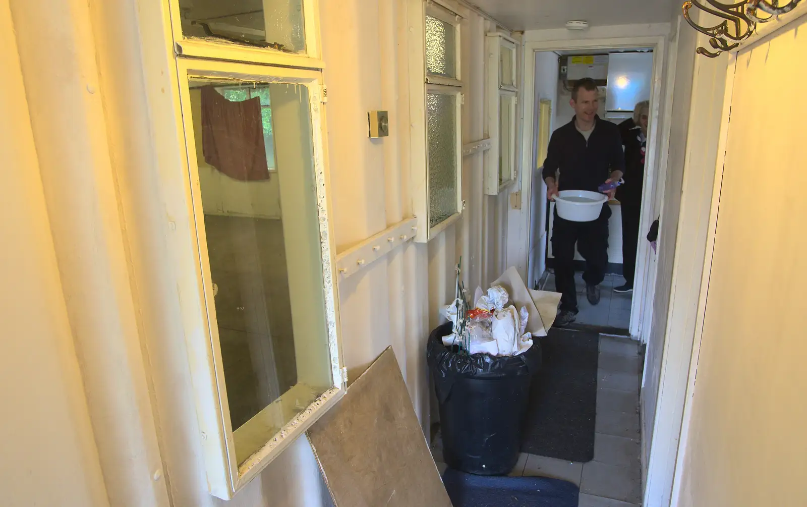 Andy carries a bowl of water out, from Demolishing The 1st Eye Scout Hut, Wellington Road, Eye, Suffolk - 11th May 2013