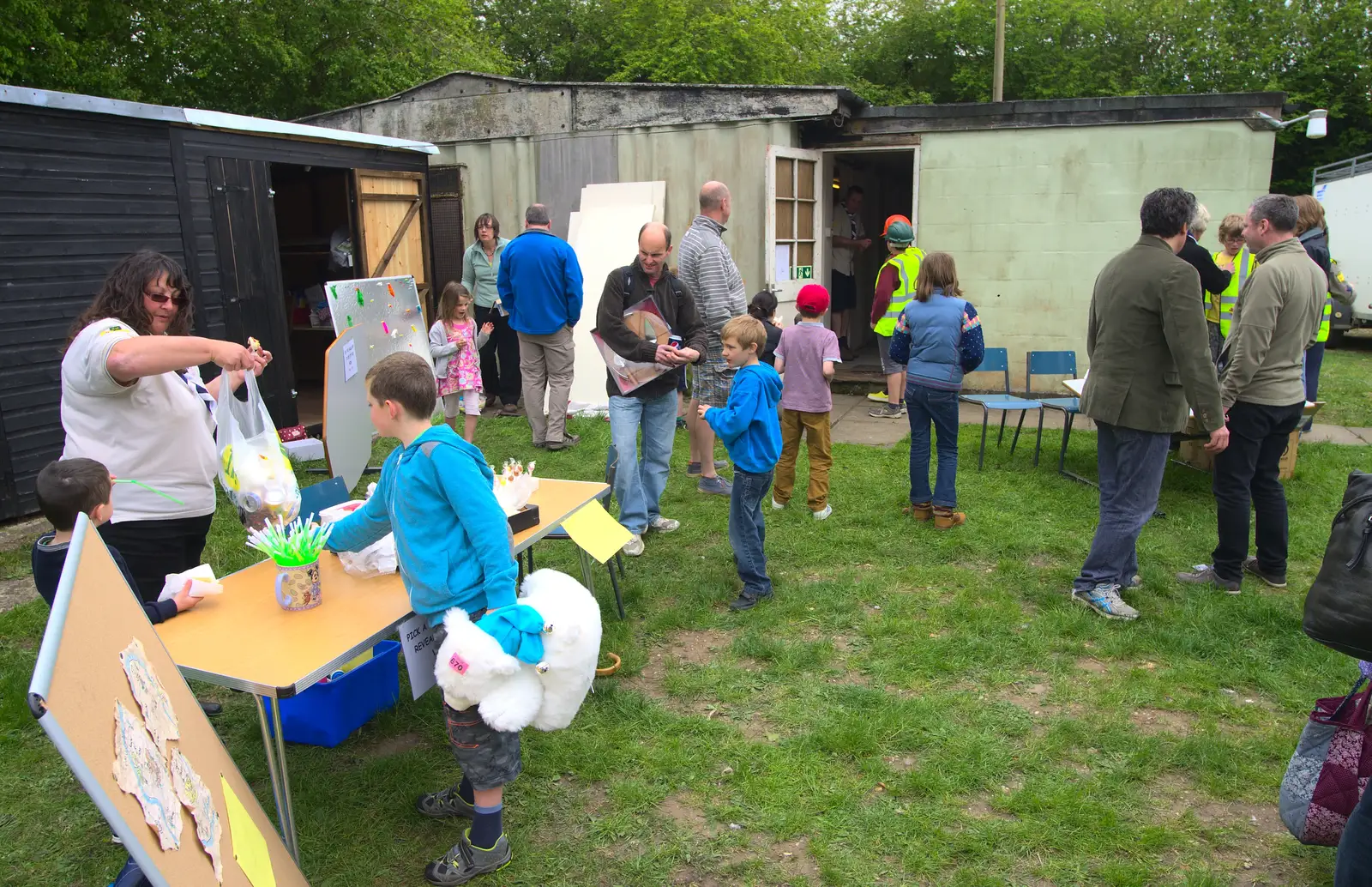 Carrie hands a bag of cans over, from Demolishing The 1st Eye Scout Hut, Wellington Road, Eye, Suffolk - 11th May 2013