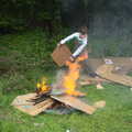 A boy fans the bonfire, Demolishing The 1st Eye Scout Hut, Wellington Road, Eye, Suffolk - 11th May 2013