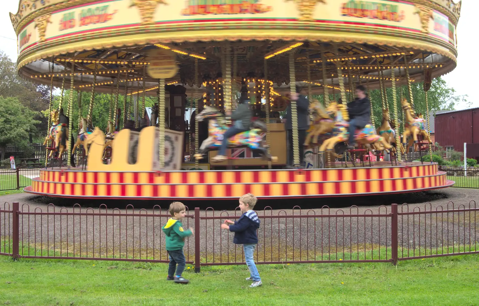 Kaine and Fred in front of the Gallopers, from A Day at Bressingham Steam and Gardens, Diss, Norfolk - 18th May 2013