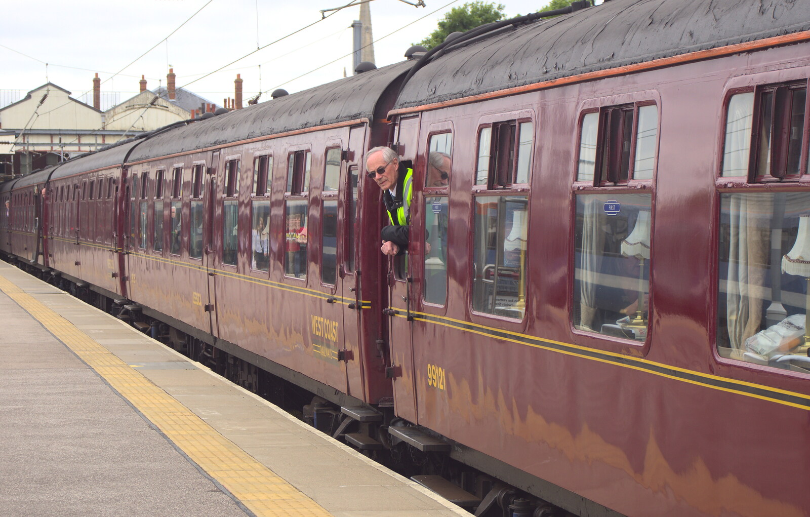 A guard looks out of the carriage from Tangmere at Norwich Station, Norwich, Norfolk - 25th May 2013