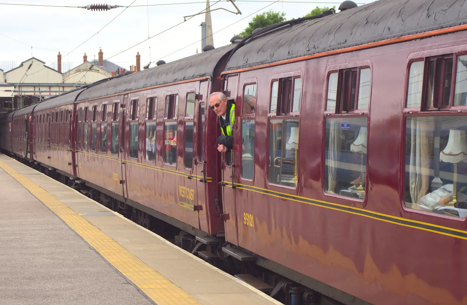 A guard looks out of the carriage, from Tangmere at Norwich Station, Norwich, Norfolk - 25th May 2013