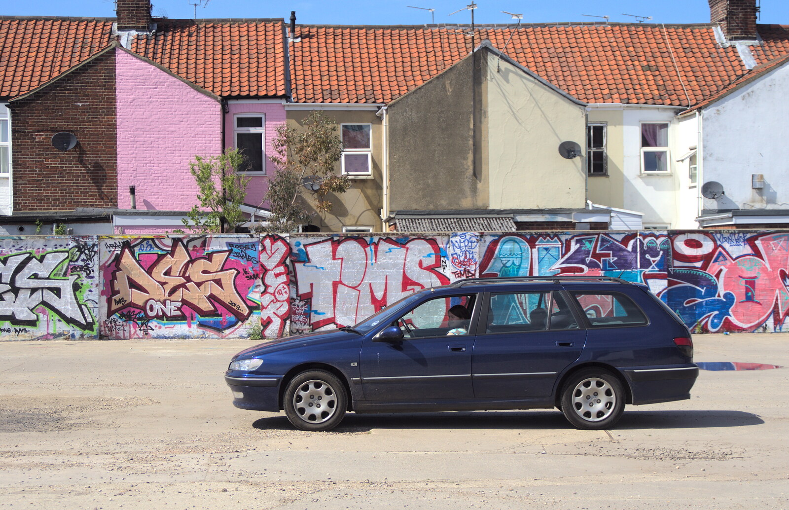 The car sits by Graffiti Wall from The Dereliction of HMSO, Botolph Street, Norwich - 26th May 2013
