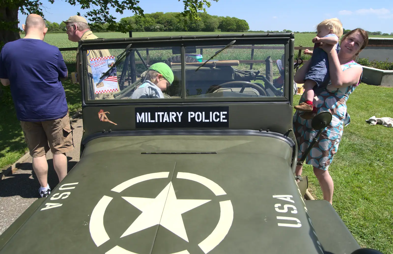 Isobel scoops Harry up, from A "Sally B" B-17 Flypast, Thorpe Abbots, Norfolk - 27th May 2013