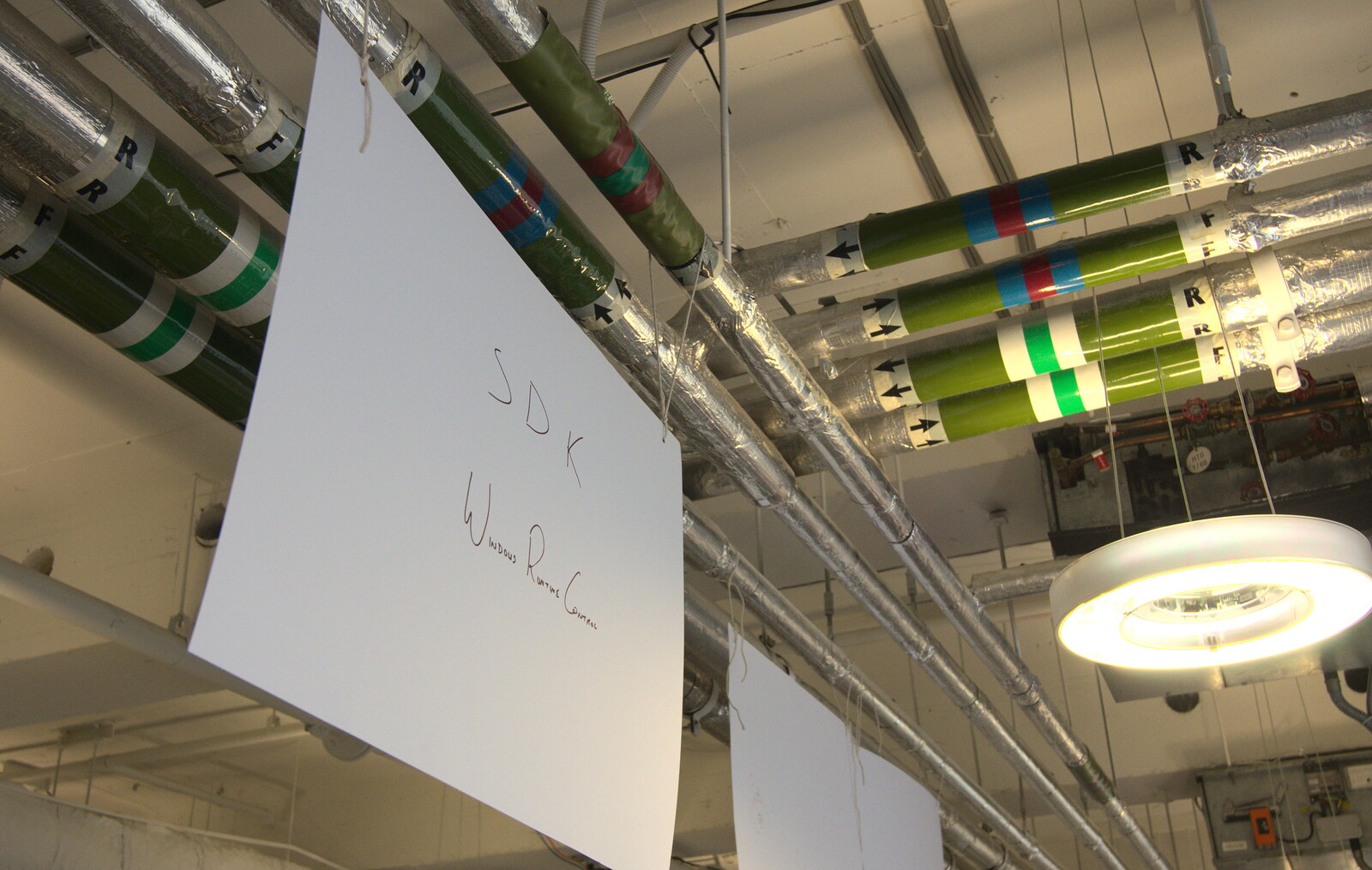 Signs dangle frmo the ceiling from A SwiftKey Hack Day, Westminster, London - 31st May 2013