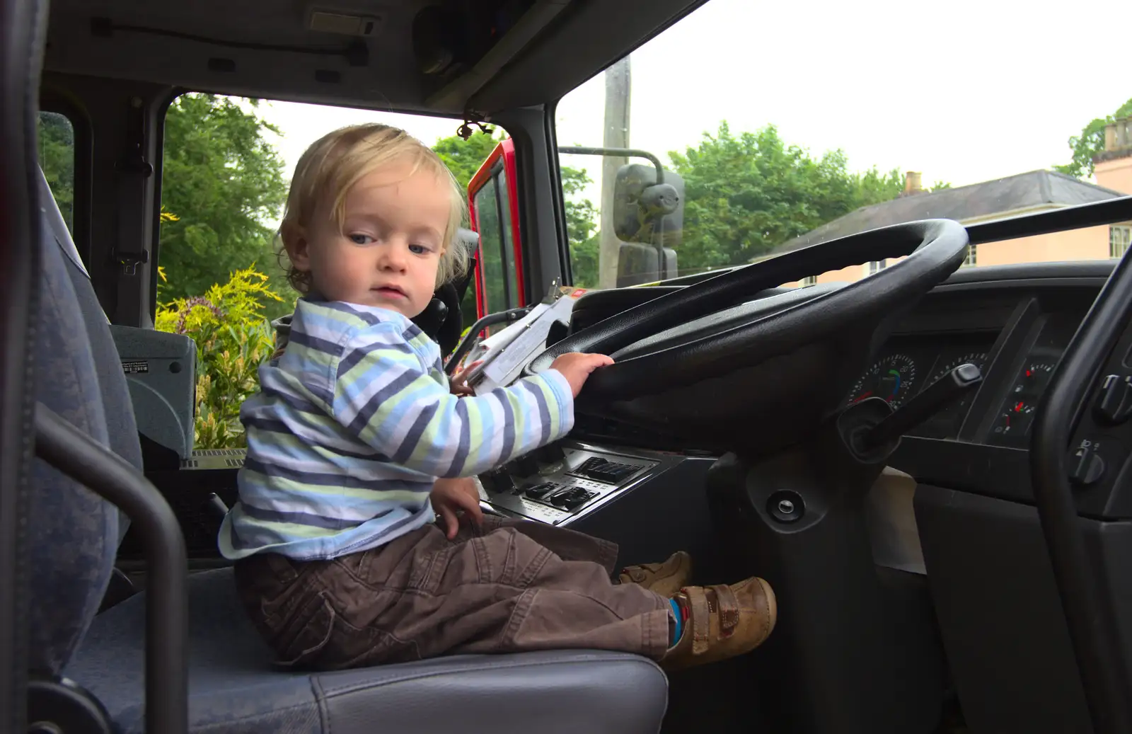 Harry in the fire engine's cab, from Eye Open Gardens, Suffolk - 1st June 2013