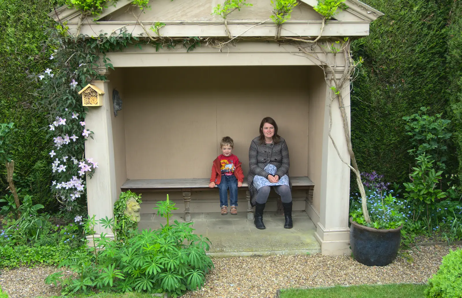 Fred and Isobel pause in a fake stone building, from Eye Open Gardens, Suffolk - 1st June 2013